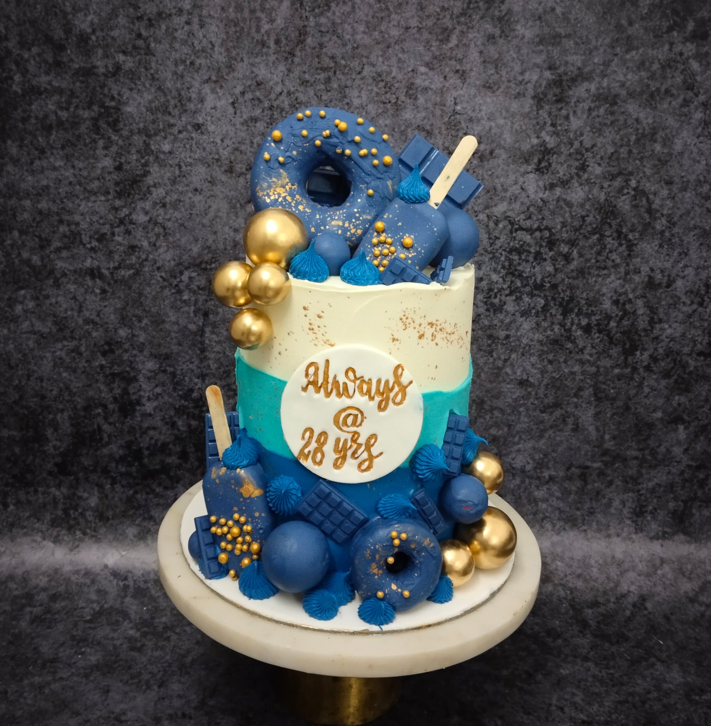 Vertical closeup shot of delicious Donut choco Birthday cake with donuts on  top and white drip Stock Photo - Alamy